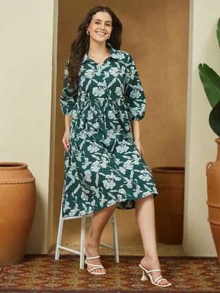This dark green cotton dress features a flattering gathered waist and feminine 3/4 puffed sleeves. Its floral print and shirt collar add charm, while the breathable fabric and side pocket ensure comfort all day. Ideal for brunch, casual days, or relaxed office wear, it’s a fresh addition to your wardrobe.